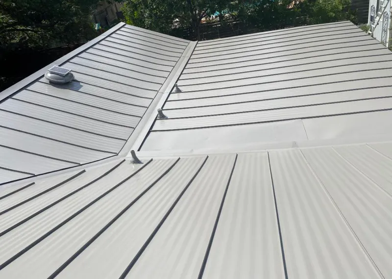 Solar attic fan installed on a metal roof for Roof Ventilation in Frankfort Square